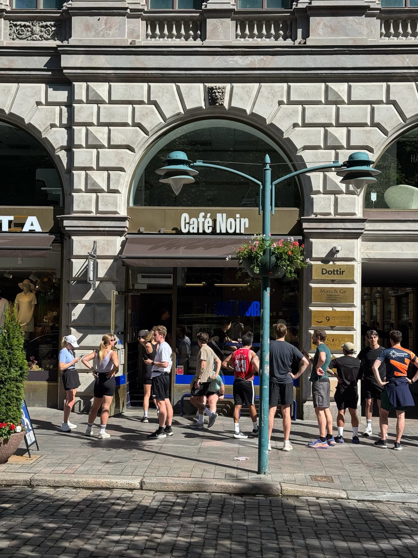 Café Noir Running Club members gathered outside the cafe on Esplanadi